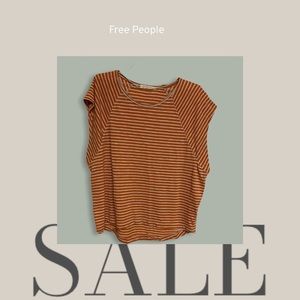 𝅺Medium Free People orange and white striped short/slit sleeved top